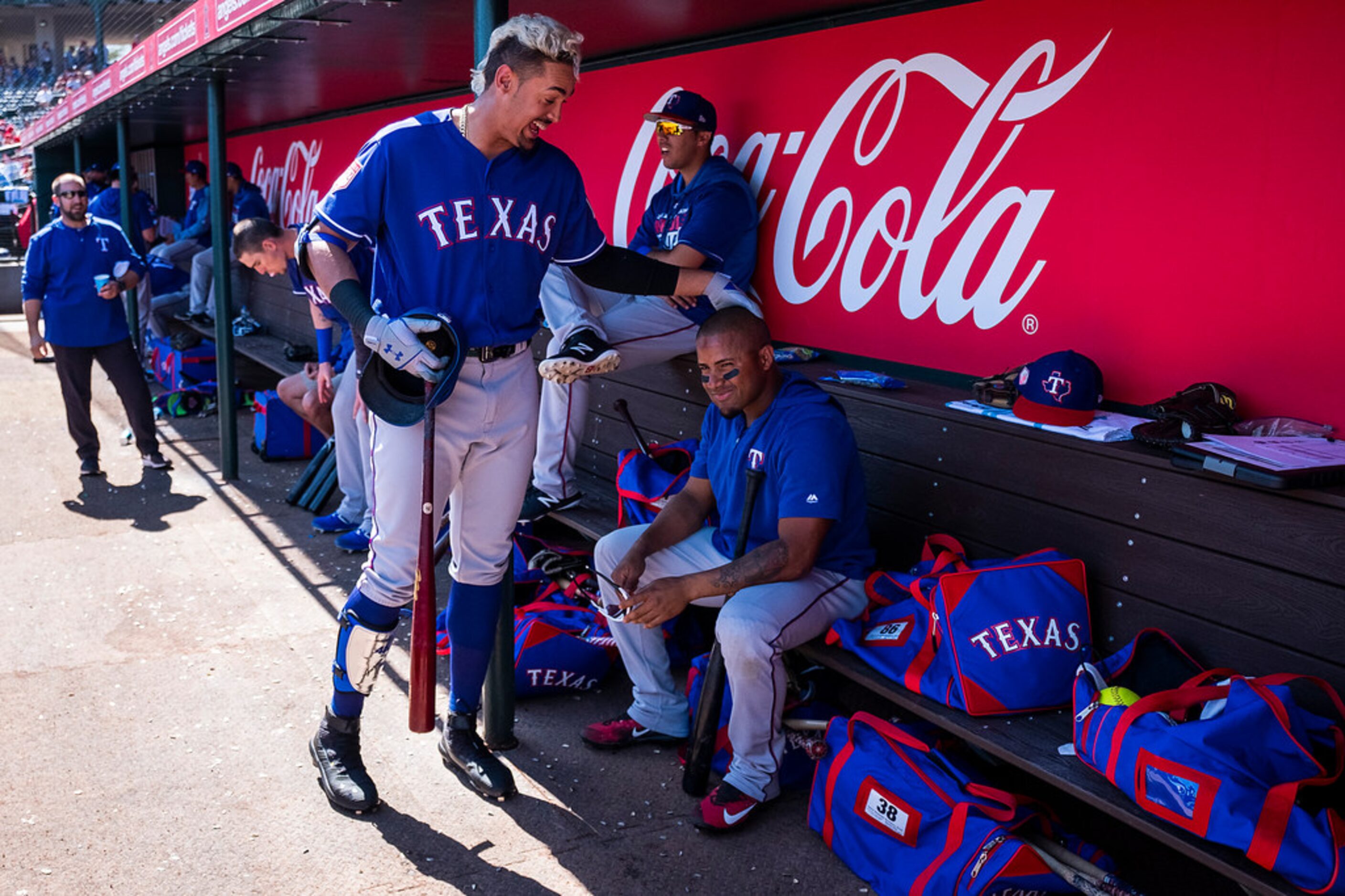 Texas Rangers first baseman Ronald Guzman (left) horses around with infielder Andy Ibanez in...