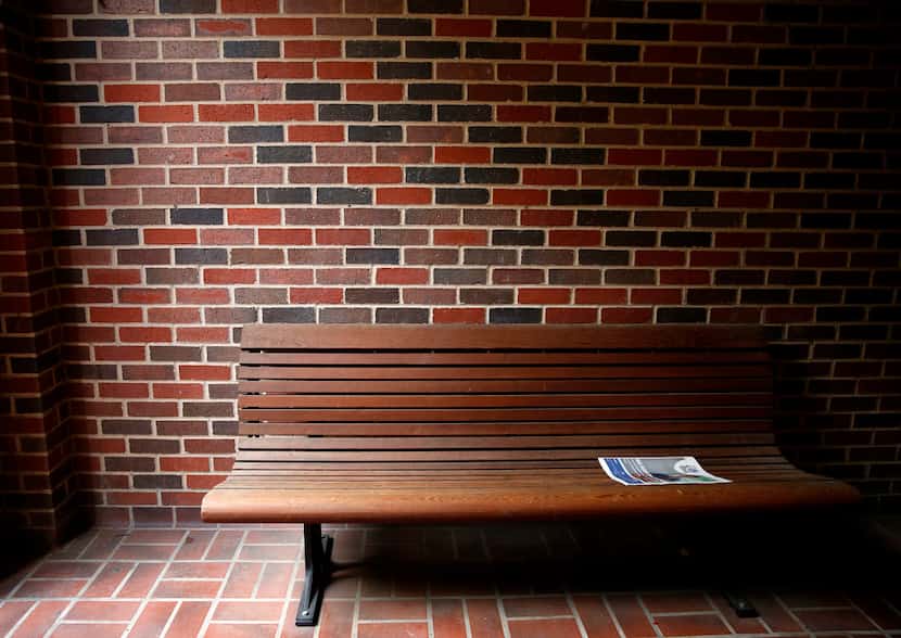 An issue of the SMU Campus Weekly, produced by The Daily Campus, is left on a bench outside...