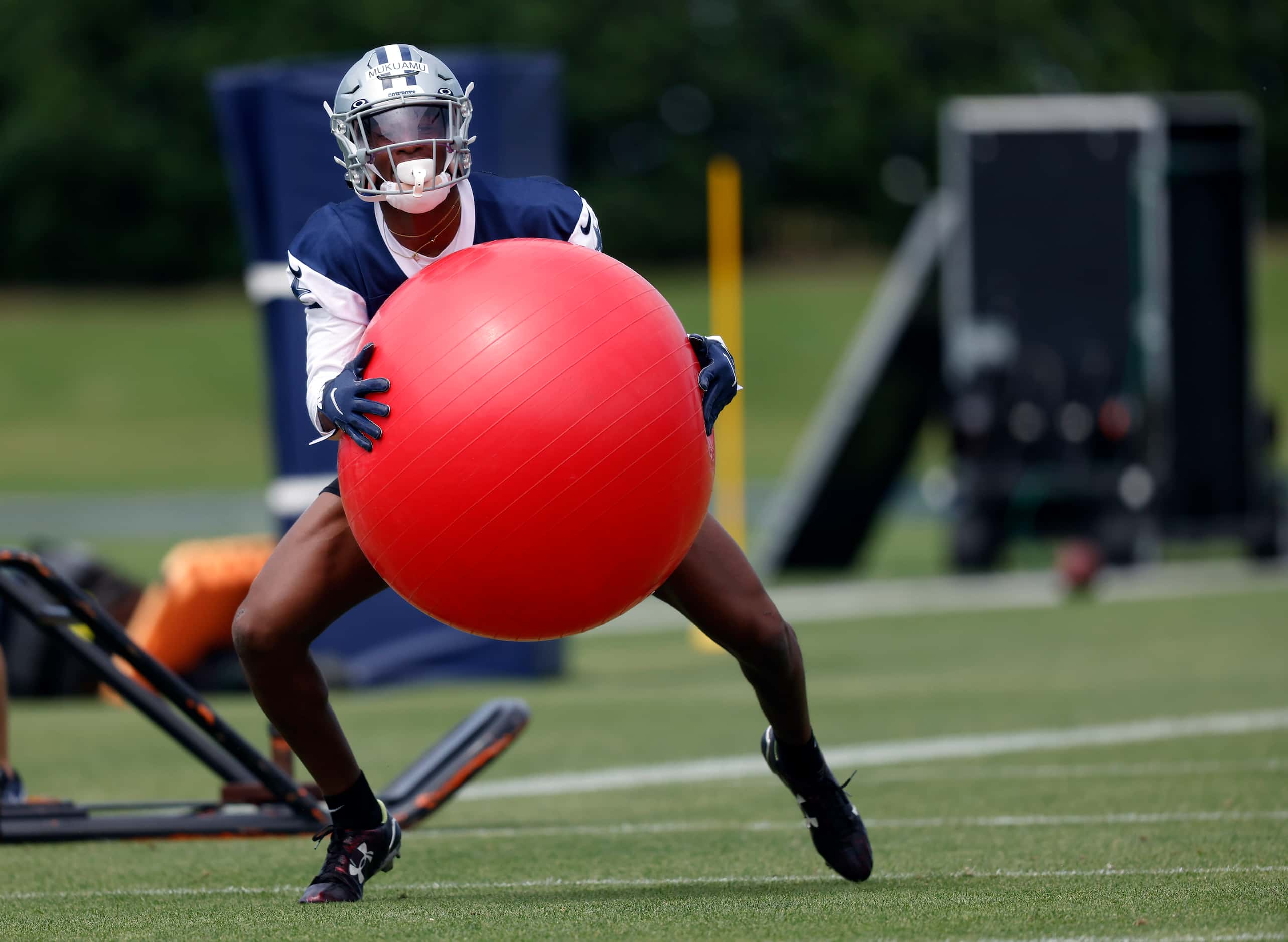 Dallas Cowboys rookie cornerback Israel Mukuamu (38) runs through drills at rookie minicamp...