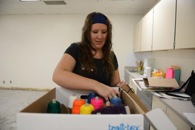 
Stephanie McPherson, Shugart Elementary School's new art teacher, unpacks supplies in the...