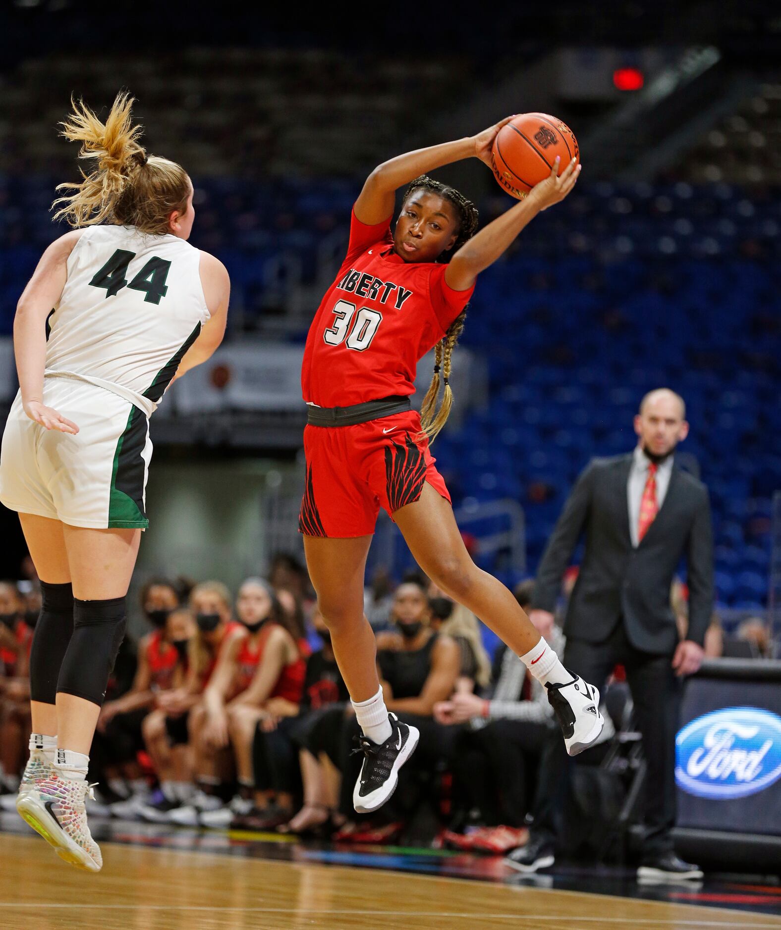 Frisco Liberty Jazzy Owens-Barnett #30 grabs a high pass in front of Cedar Park Shelby Hayes...