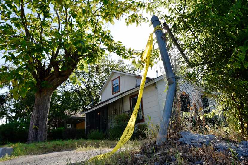 Crime scene tape remained outside of a house on Aug. 18, 2019, on the 4200 block of Jamaica...