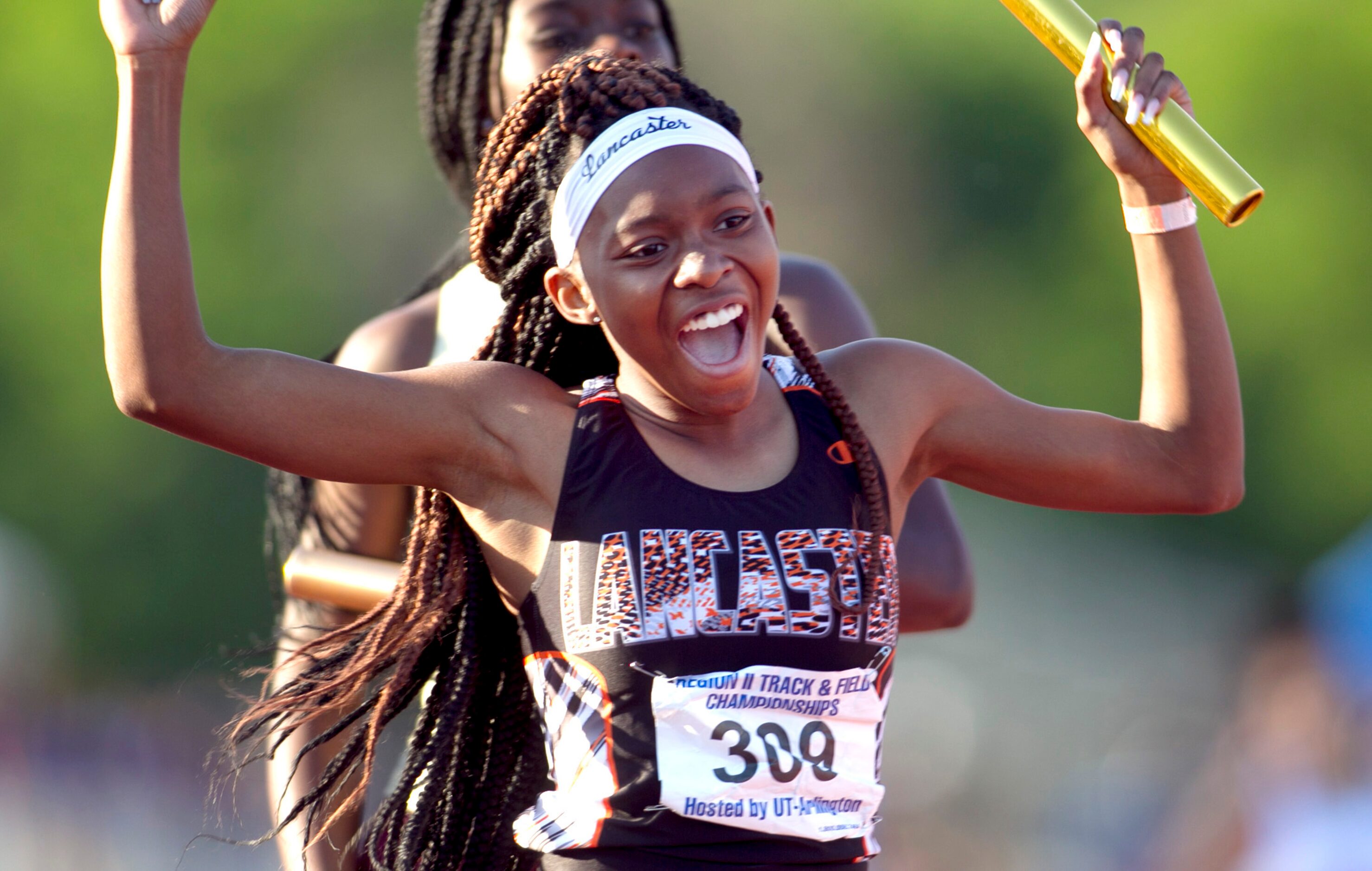 Lancaster freshman Addison Stricklin sports a smile after solidifying a solid performance by...