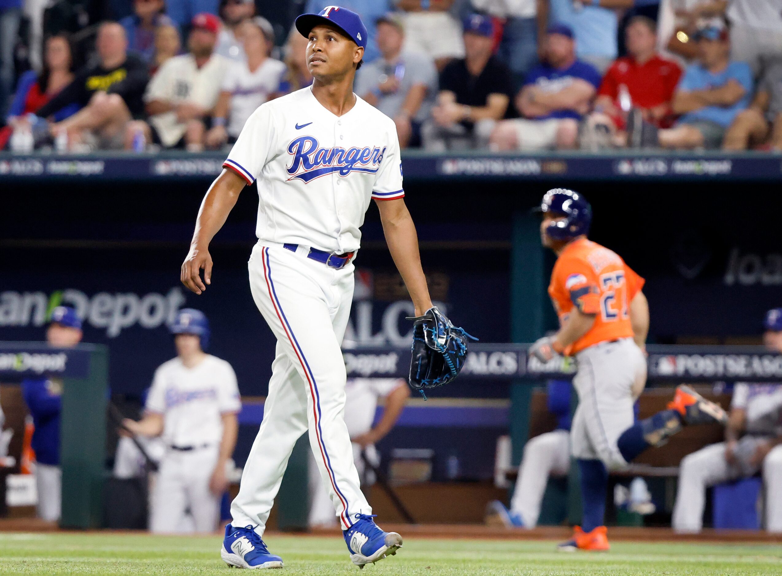 Texas Rangers relief pitcher Jose Leclerc (25) watches Houston Astros batter Jose Altuve’s...