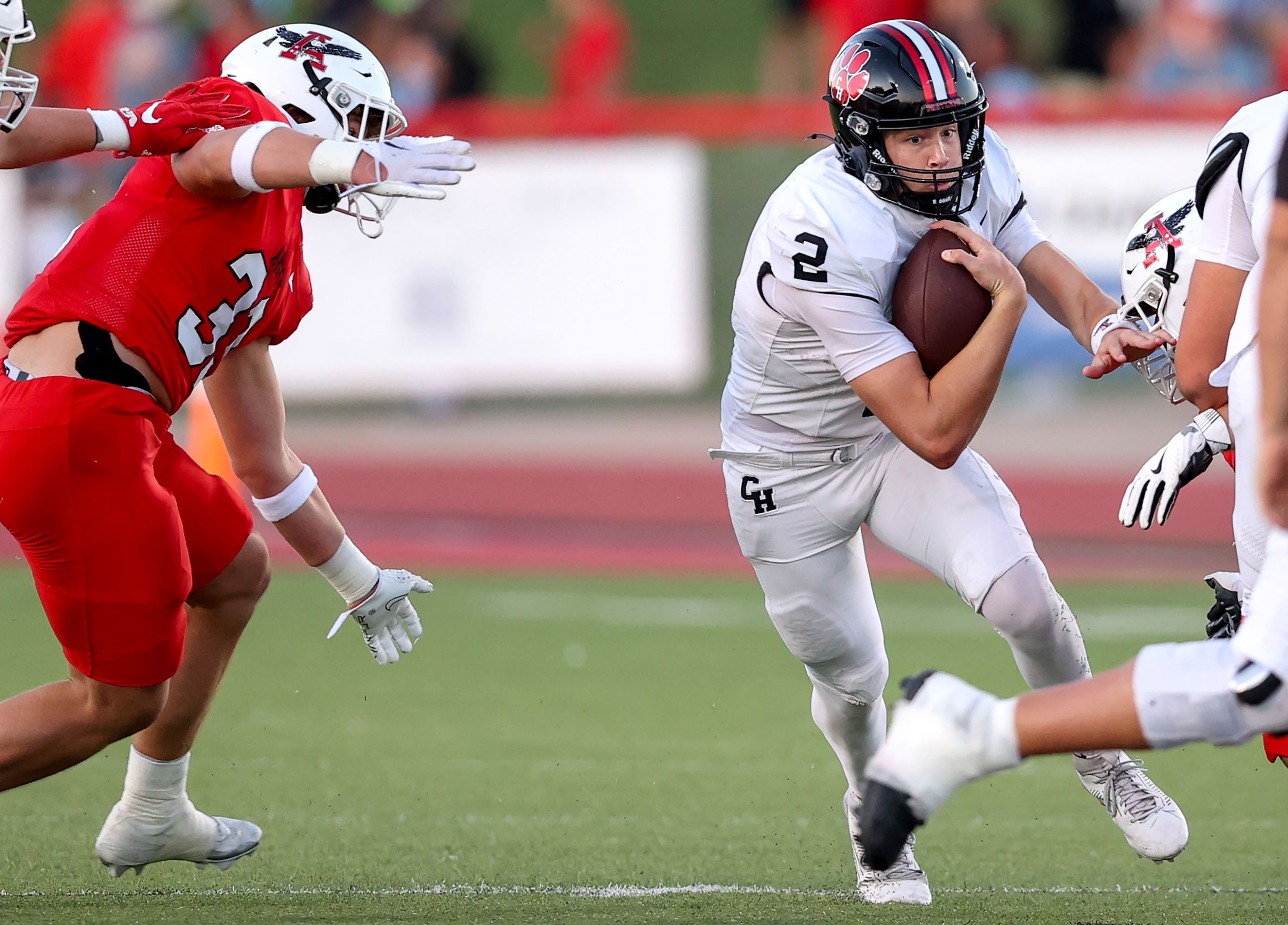 Colleyville Heritage quarterback Bodey Weaver (2) finds a hole to run against Argyle...