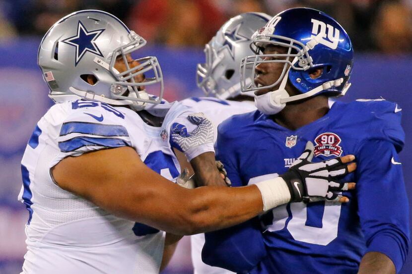 Dallas Cowboys guard Ronald Leary (65) and New York Giants defensive end Jason Pierre-Paul...