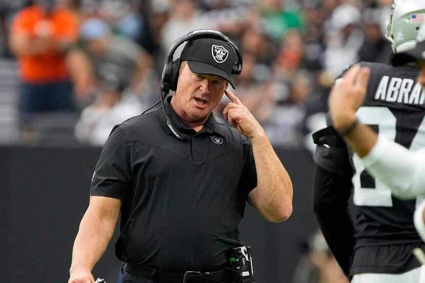 Las Vegas Raiders head coach Jon Gruden speaks on his headset during the first half of an...