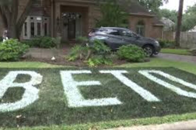 This large "Beto" sign painted in the grass has caused some controversy in Katy, a suburb...