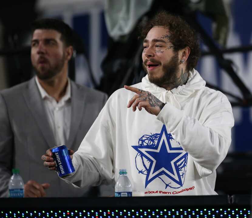 In this Jan. 12, 2019 file photo, Post Malone watches the Dallas Cowboys and Los Angeles...