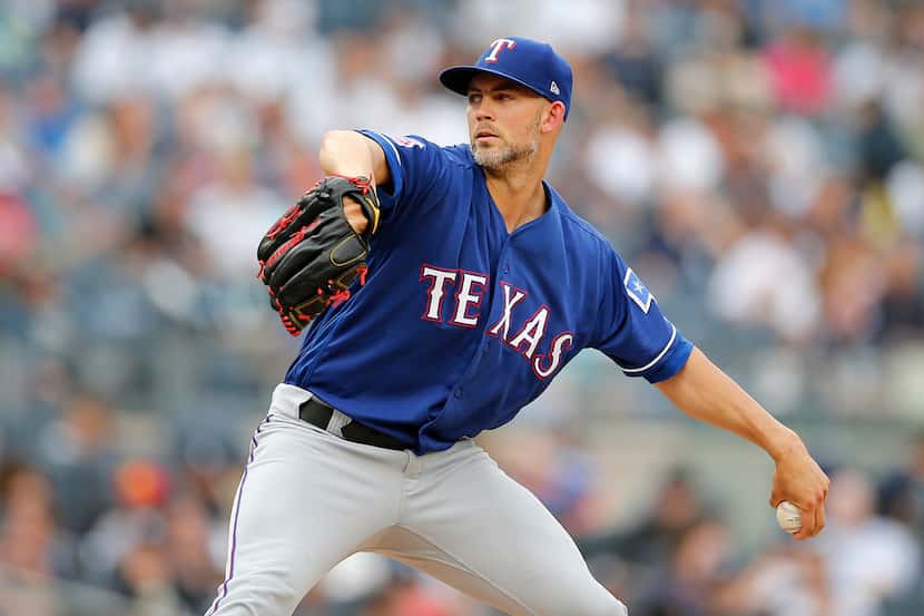 Mike Minor #23 of the Texas Rangers pitches during the second inning against the New York...