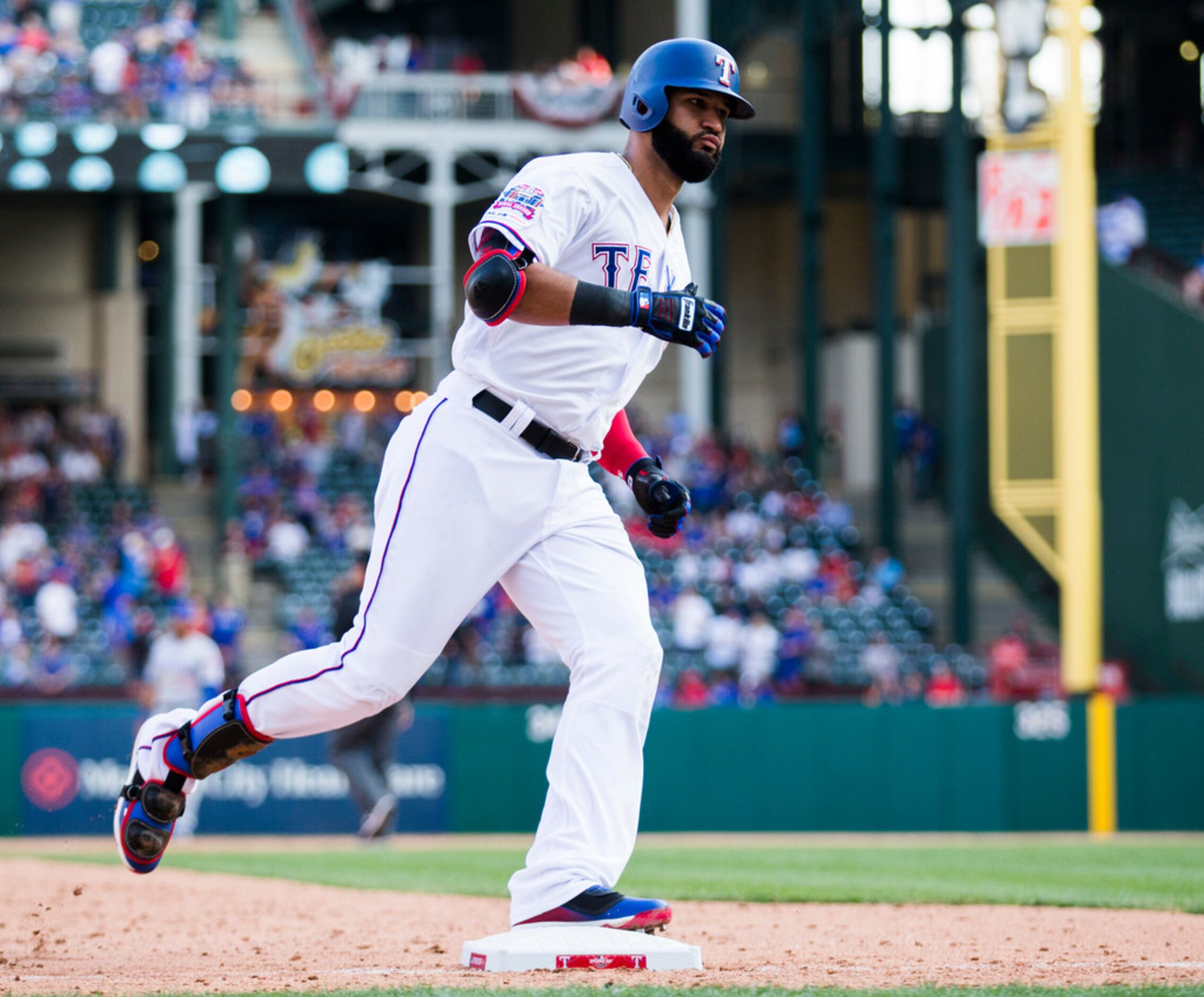 Texas Rangers right fielder Nomar Mazara (30) rounds third base after hitting a home run...