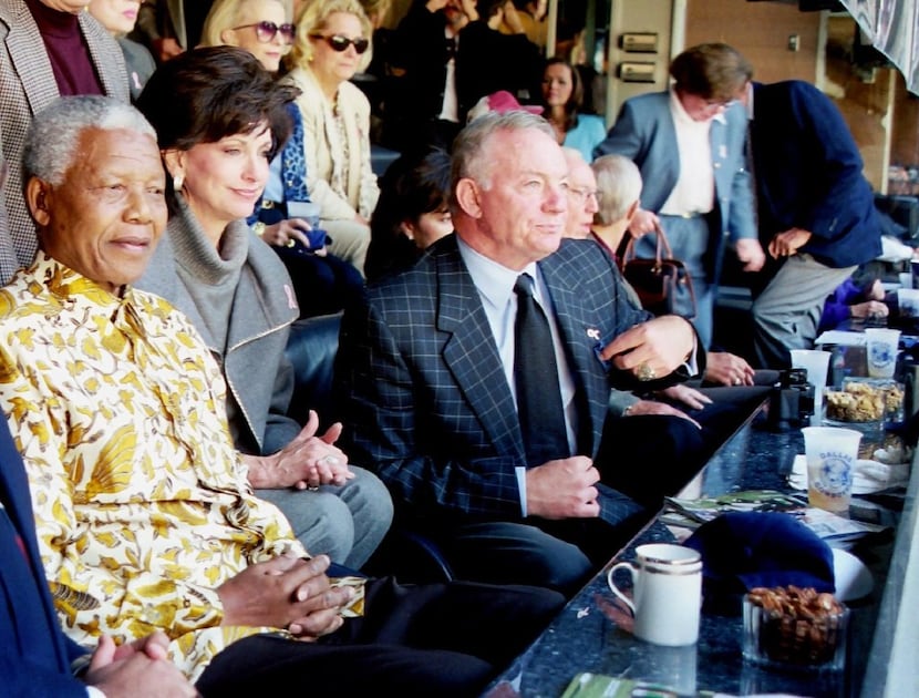 Former South African President Nelson Mandela watches the Dallas Cowboys play the Washington...