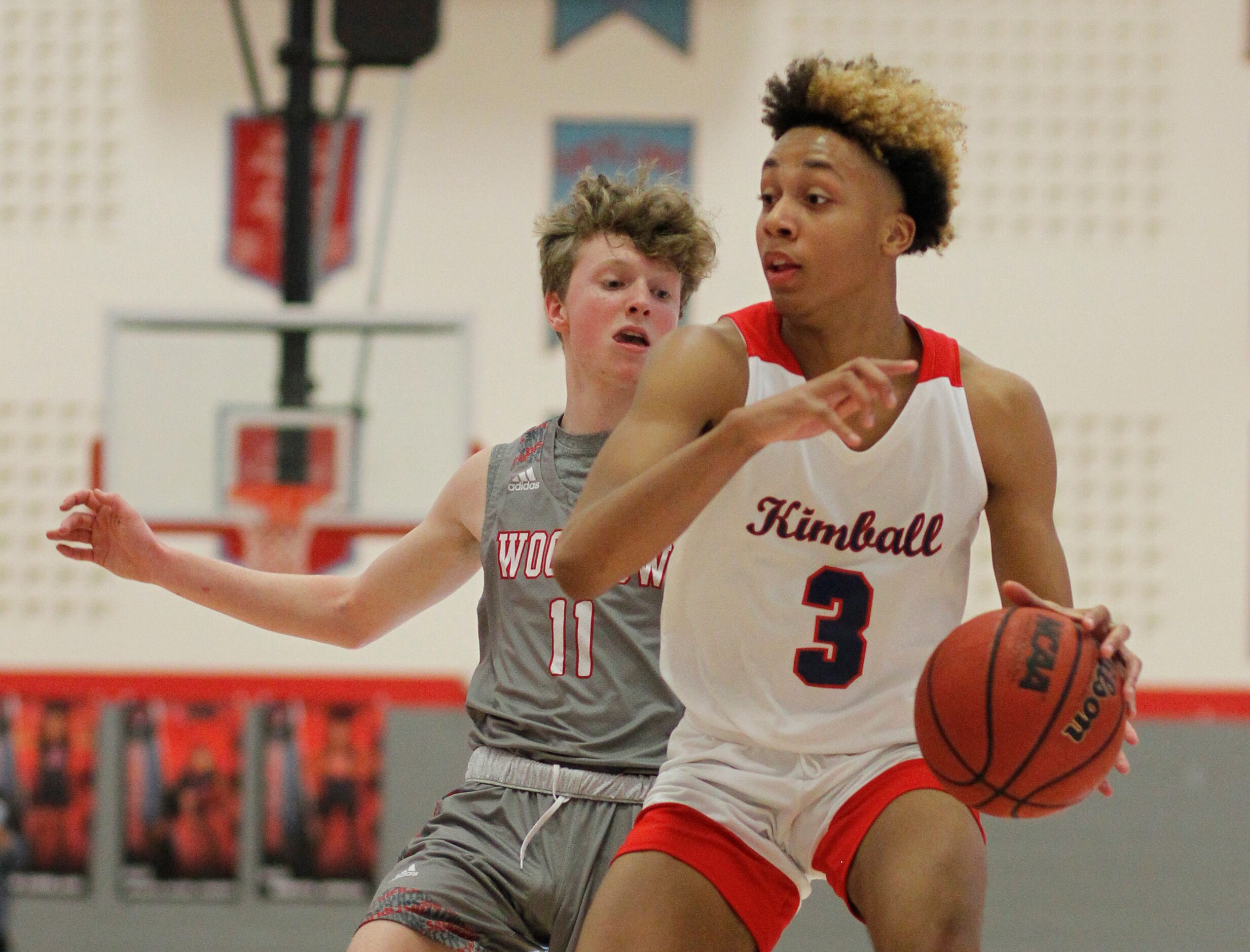 Dallas Kimball guard Chauncey Gibson (3) drives inside as Dallas Woodrow defender Adam Kirby...