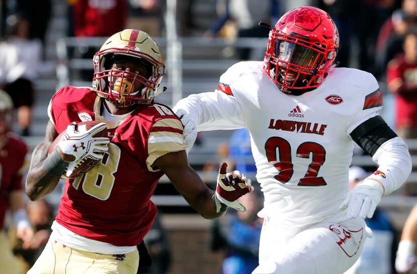 Boston College wide receiver Thadd Smith tries to out run Louisville linebacker Devonte...