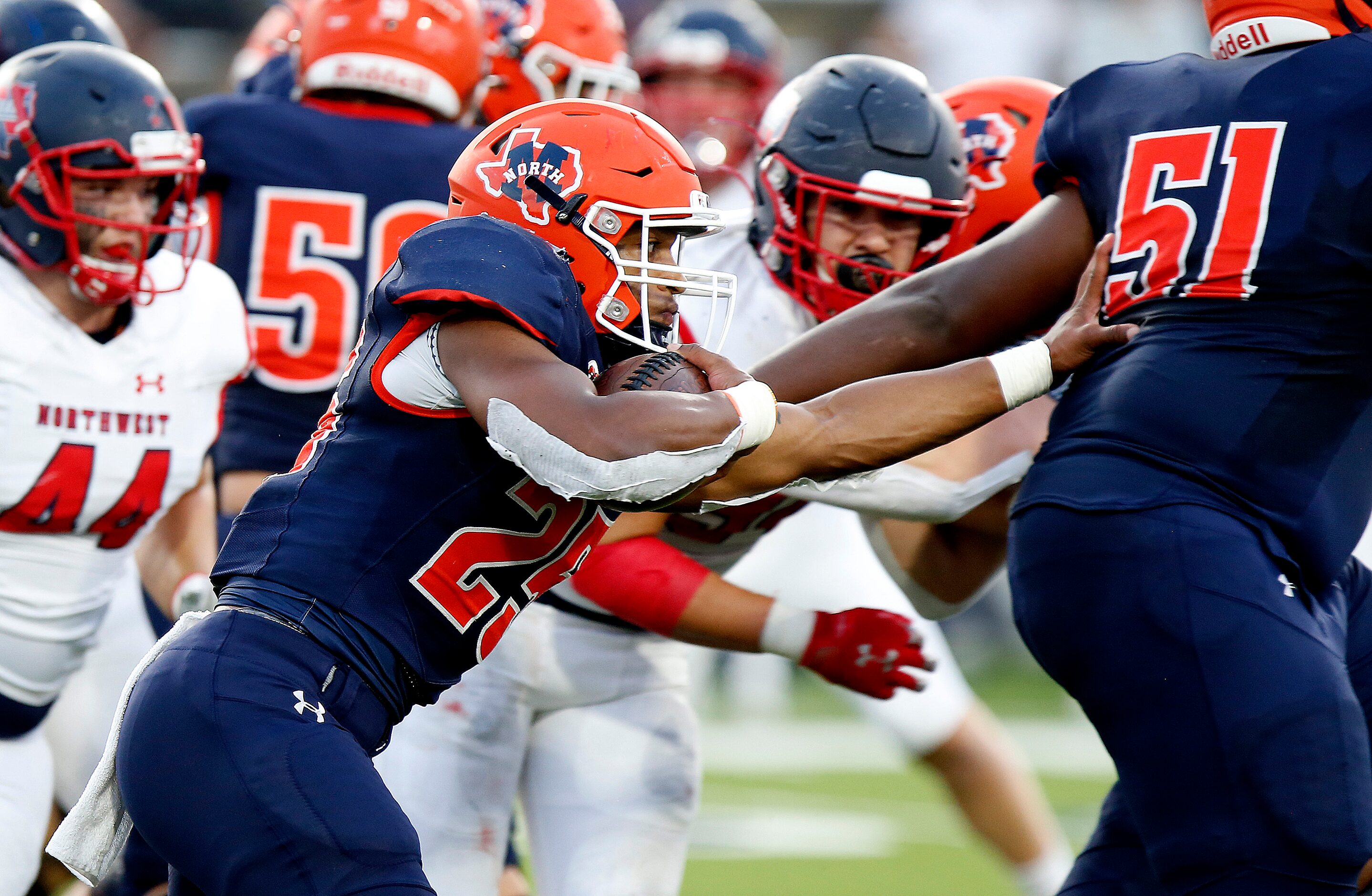 McKinney North High School running back Jadan Smith (25) follows the block of McKinney North...