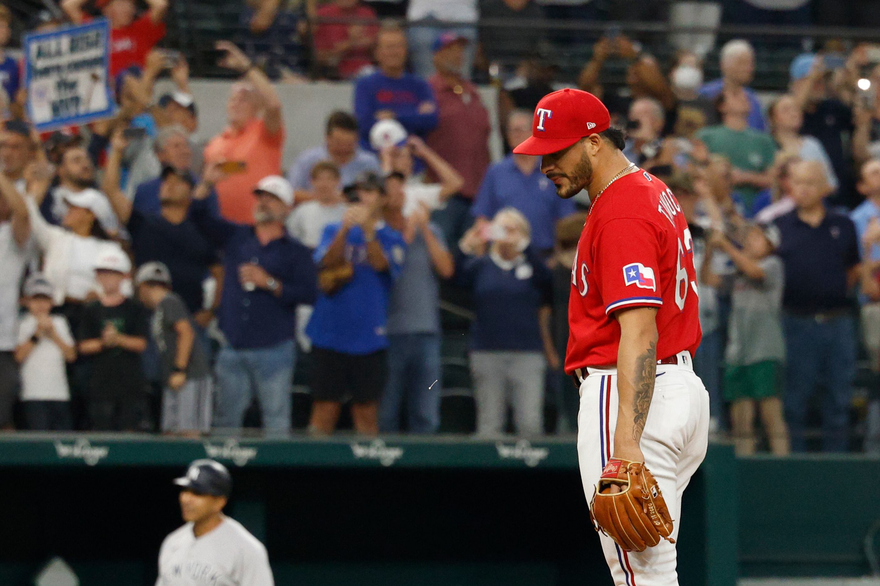 Texas Rangers relief pitcher Jesus Tinoco (63) reacts as New York Yankees right fielder...