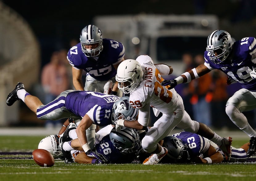 MANHATTAN, KS - DECEMBER 01:  Safety Sheroid Evans #29 of the Texas Longhorns battles...