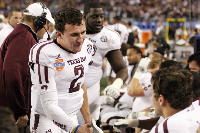 Texas A&M Aggies quarterback Johnny Manziel (2) thanks the offensive line at the end of the...