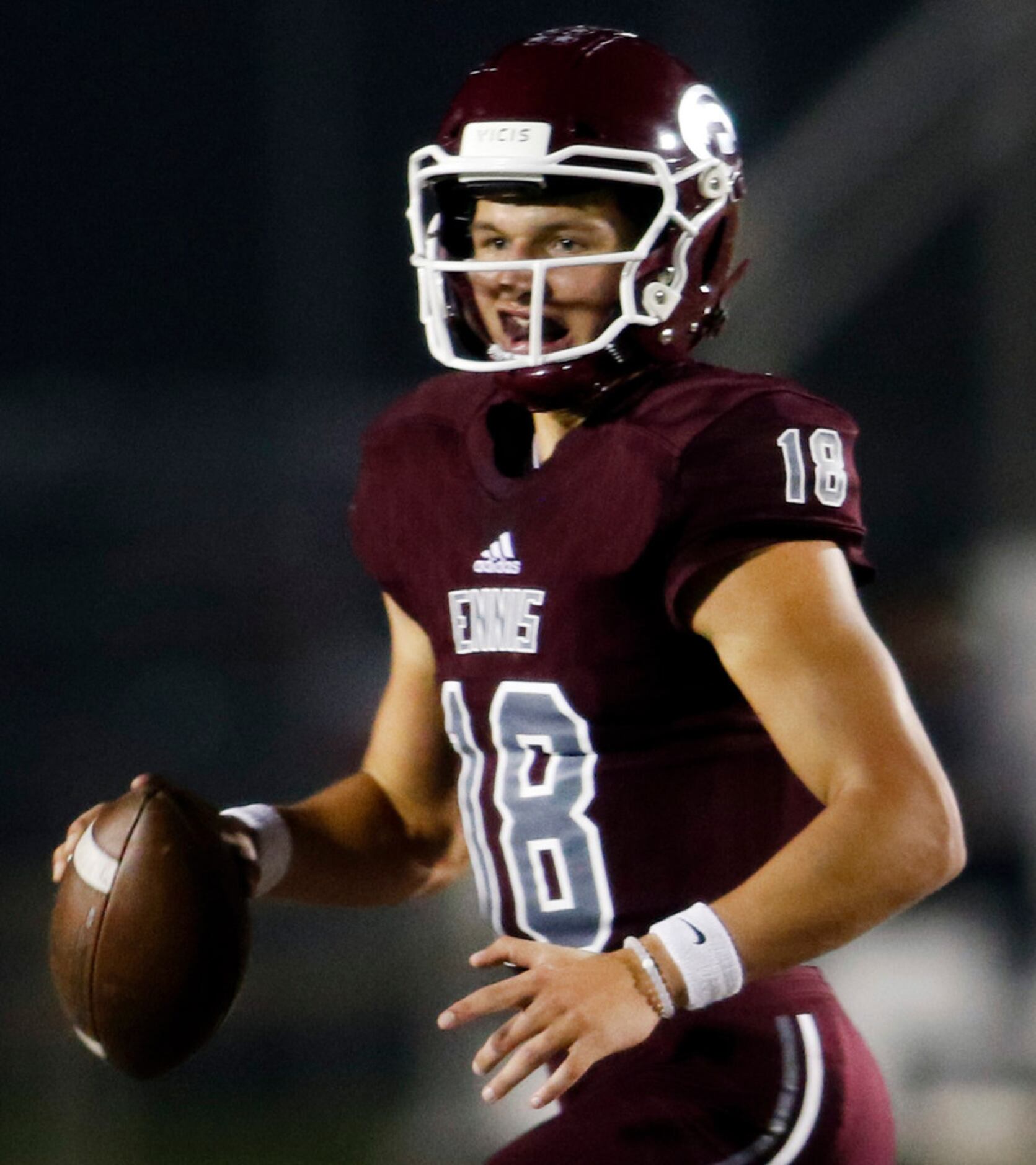 Ennis quarterback Collin Drake (18) looks to pass during first half action against Royse...