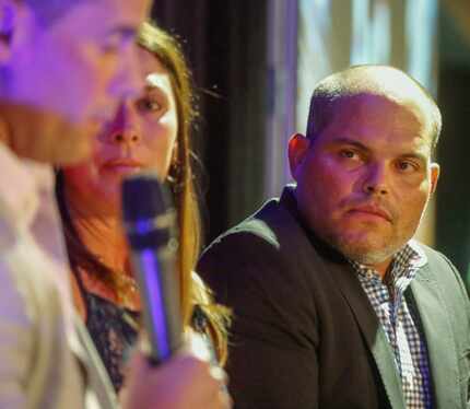 National Baseball Hall of Famer Ivan "Pudge" Rodriguez (right) listens to former fellow...