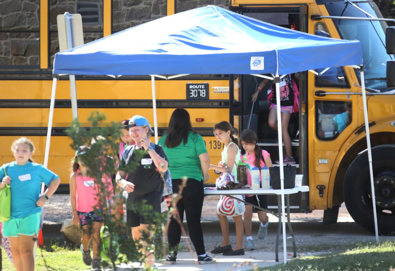 Girl Scouts arrived at summer camp at Camp Whispering Cedars in Dallas on Thursday.