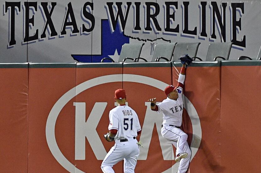 Texas Rangers center fielder Leonys Martin (2) makes a catch on a ball hit by Oakland...