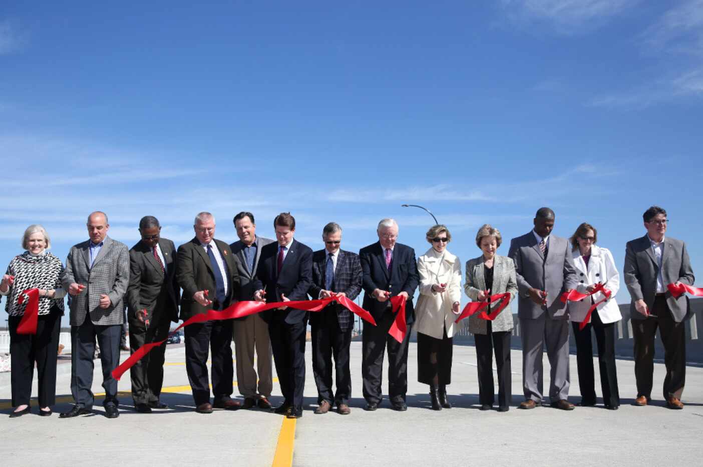 City officials gathered with lawmakers and state engineers to open the new overpass at...