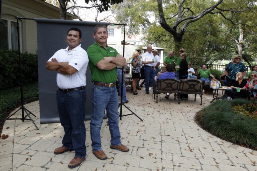 Ronnie Contreras, left, and Alvin Cozby, employees of Scott+Reid General Contractors, Inc....