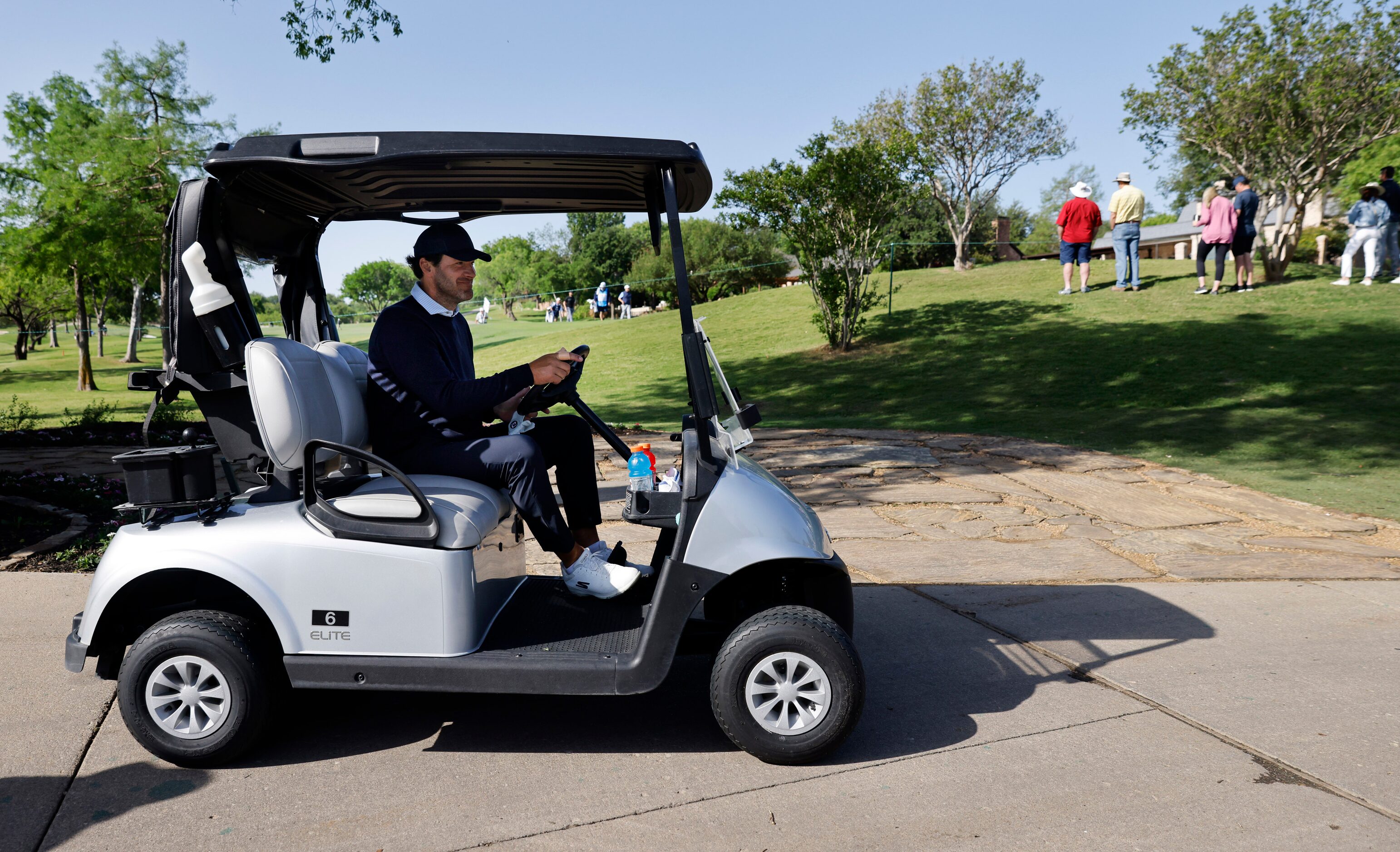 Former Dallas Cowboys quarterback Tony Romo uses a cart to get around the course as he...