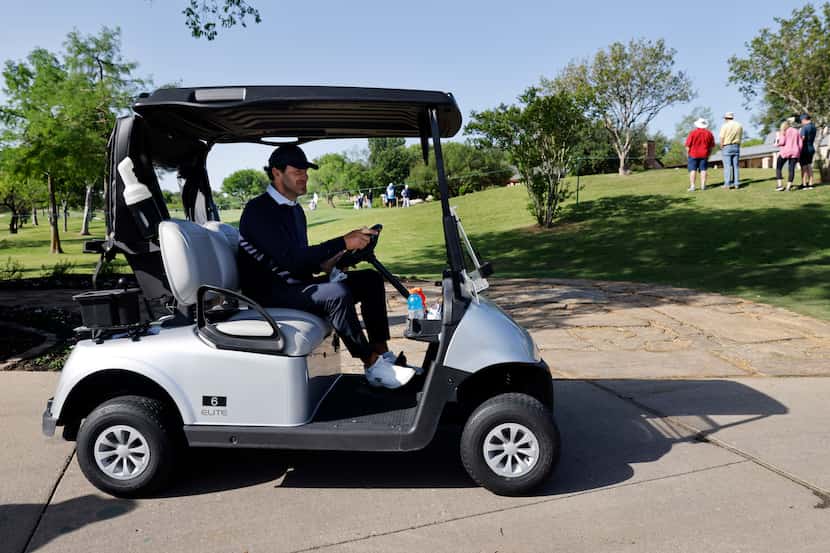 Former Dallas Cowboys quarterback Tony Romo uses a cart to get around the course as he...