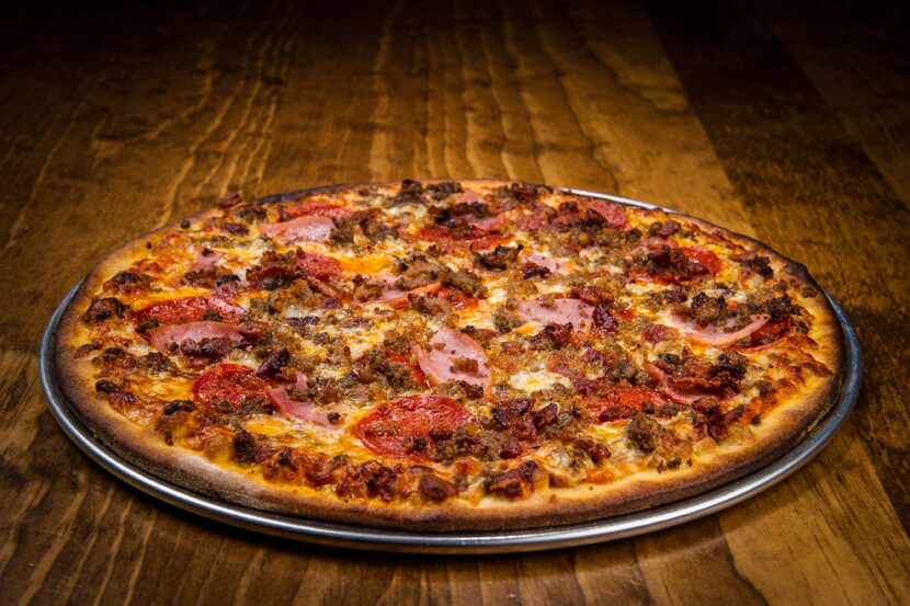 Topped with five different meats, the Mucho Meato pizza at Greenville Avenue Pizza Company...