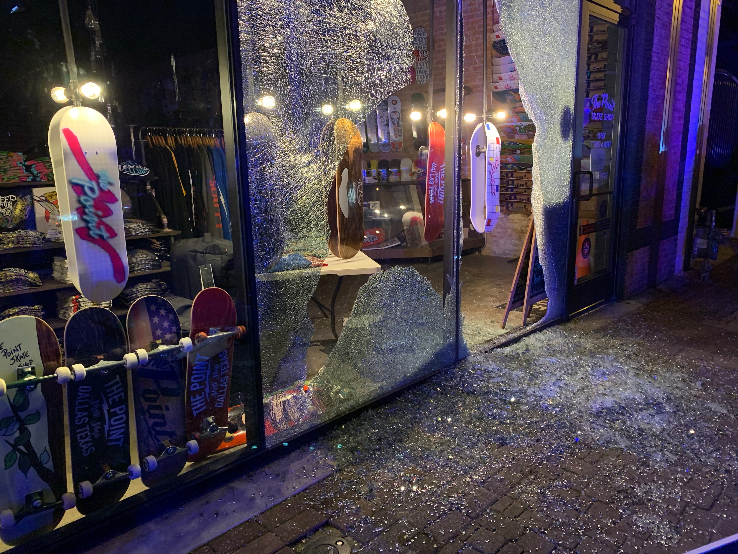 Broken out windows along Main Street in the Deep Ellum area after protesters passed by...