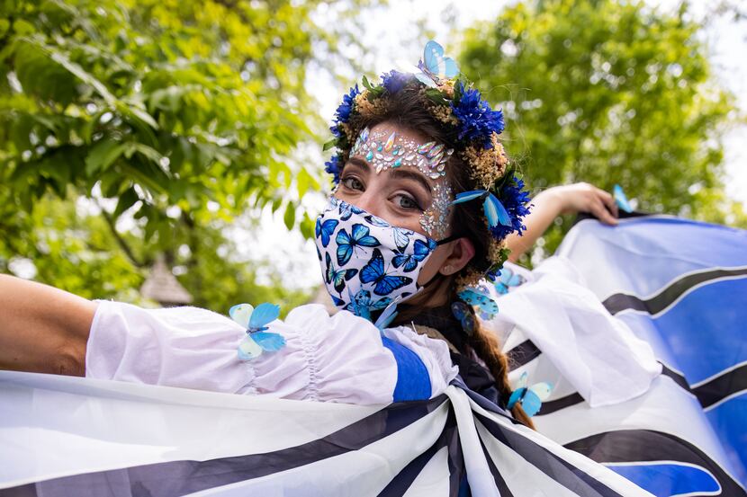Stephanie Benjamin of Fort Worth dons butterfly wings at Scarborough Renaissance Festival in...
