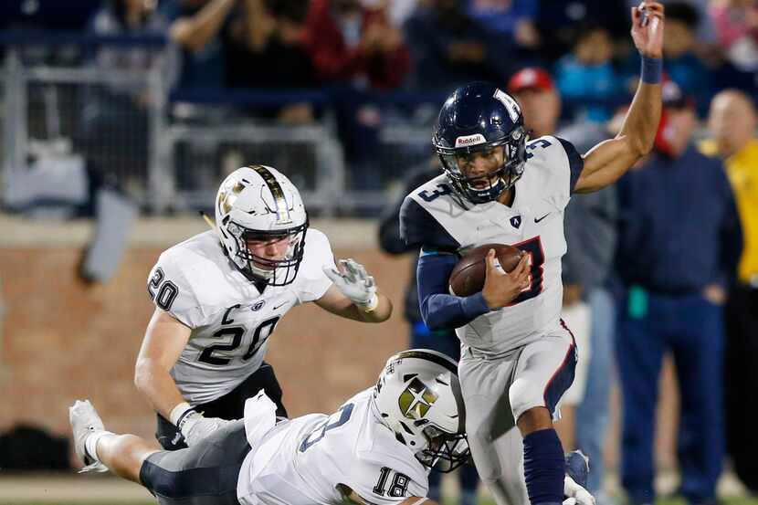 Allen's Raylen Sharpe (3) attempts to evade Jesuit's Robert Fitzgerald (18) and Jack Barton...