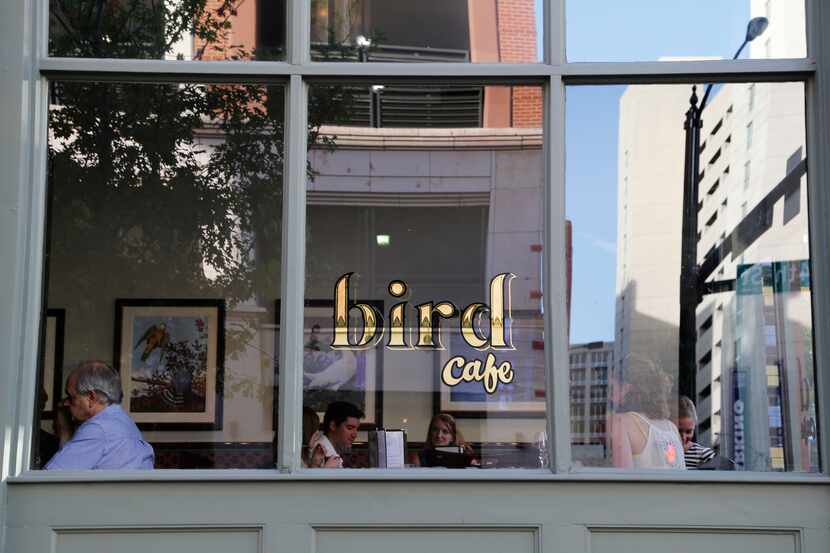 Diners converse and eat dinner at Bird Cafe in Fort Worth in June 2014.