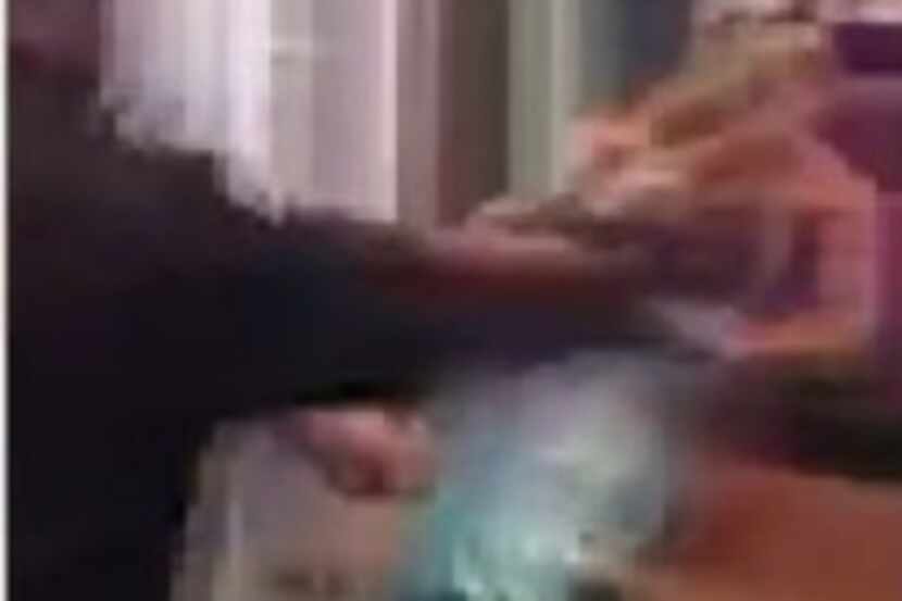  Cellphone footage shows a scuffle between a security guard and members of a Houston...