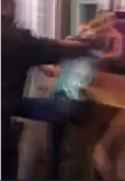  Cellphone footage shows a scuffle between a security guard and members of a Houston...