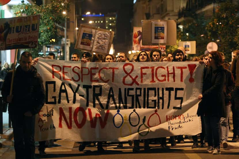 Demonstrators marched during a protest against a controversial anti-gay and blasphemy laws...