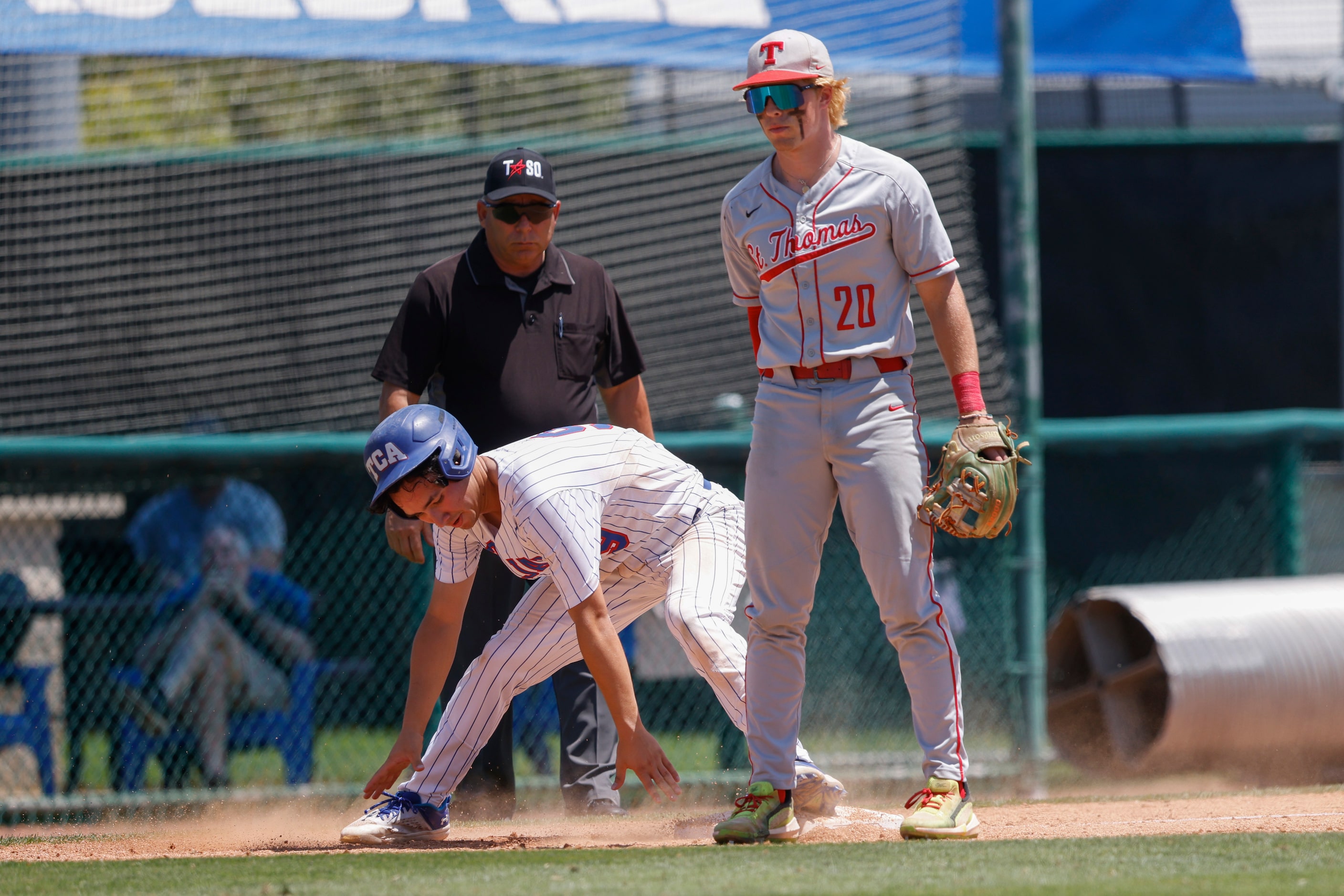 Trinity Christian player Joshua Liu (9) steals third base against Houston St. Thomas’ Billy...