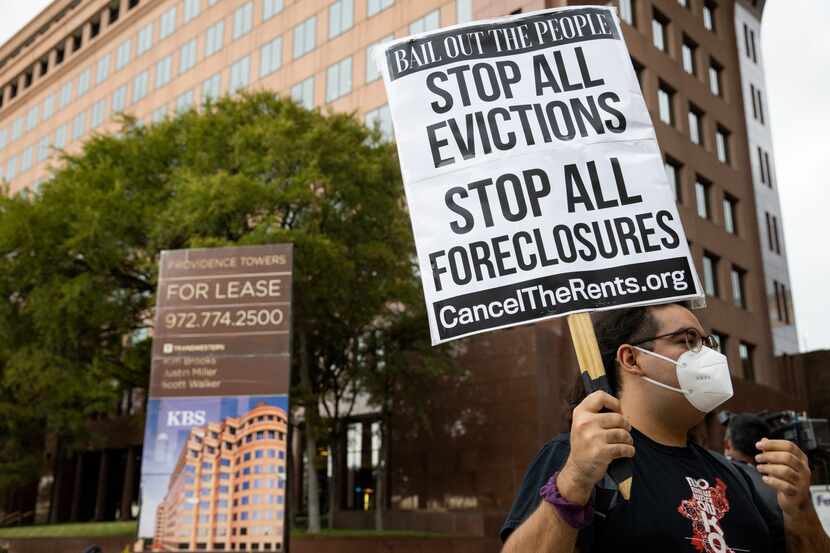 Protesters picket outside of the office of Senator John Cornyn on Sept. 1, 2020 in Dallas.