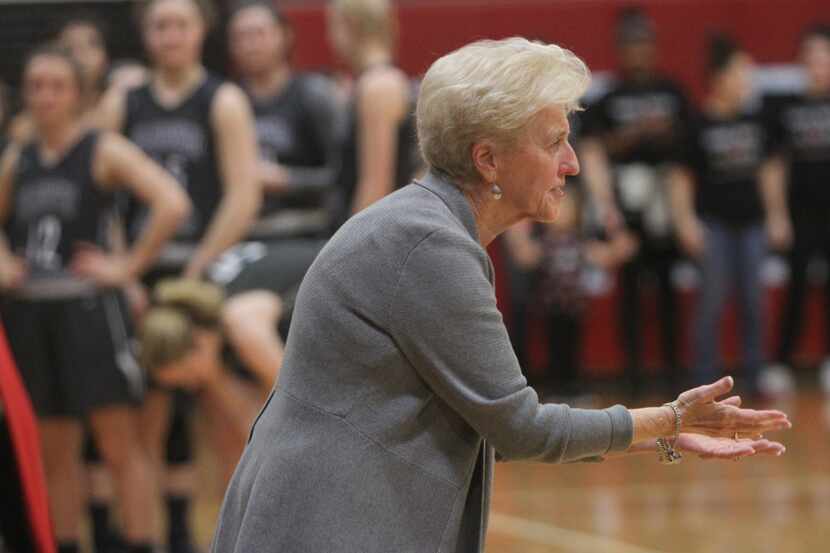 Euless Trinity head coach Sue Cannon welcomes her players to the court during team...