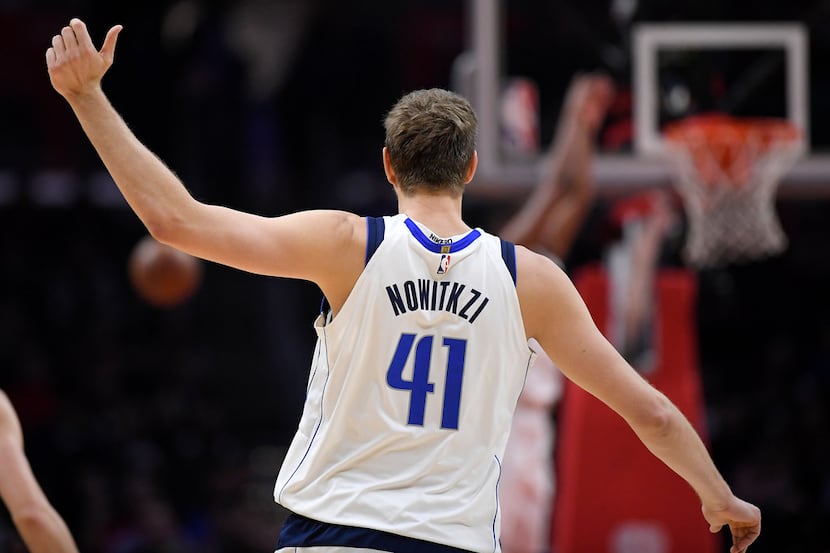 Dallas Mavericks forward Dirk Nowitzki, of Germany, is seen with his name spelled wrong on...