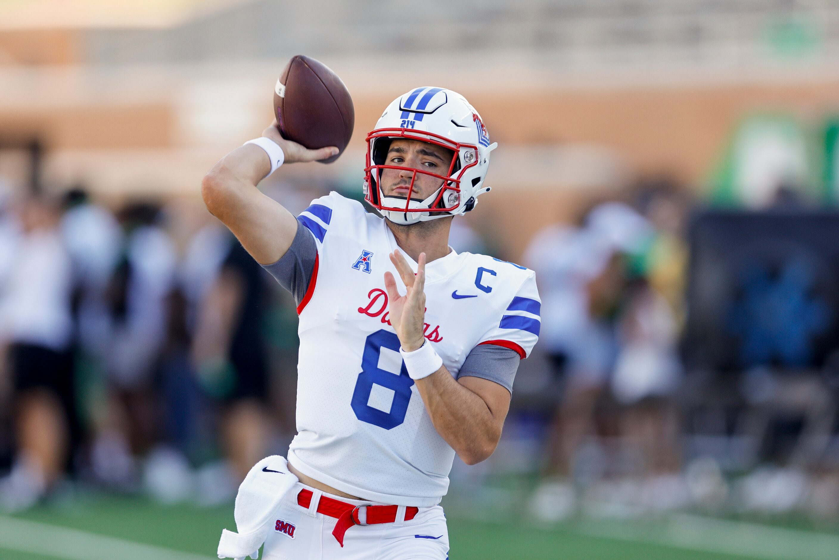 SMU quarterback Tanner Mordecai (8) warms-up before a game against UNT at Apogee Stadium in...