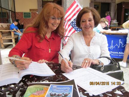 Judith Turner, a volunteer with Democrats Abroad in Mexico, helps a resident in San Miguel...