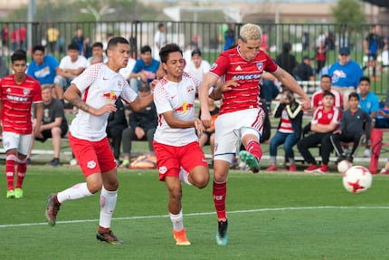 Brayan Padilla of FC Dallas (right, shooting) playing in the 2018 Dallas Cup against Red...
