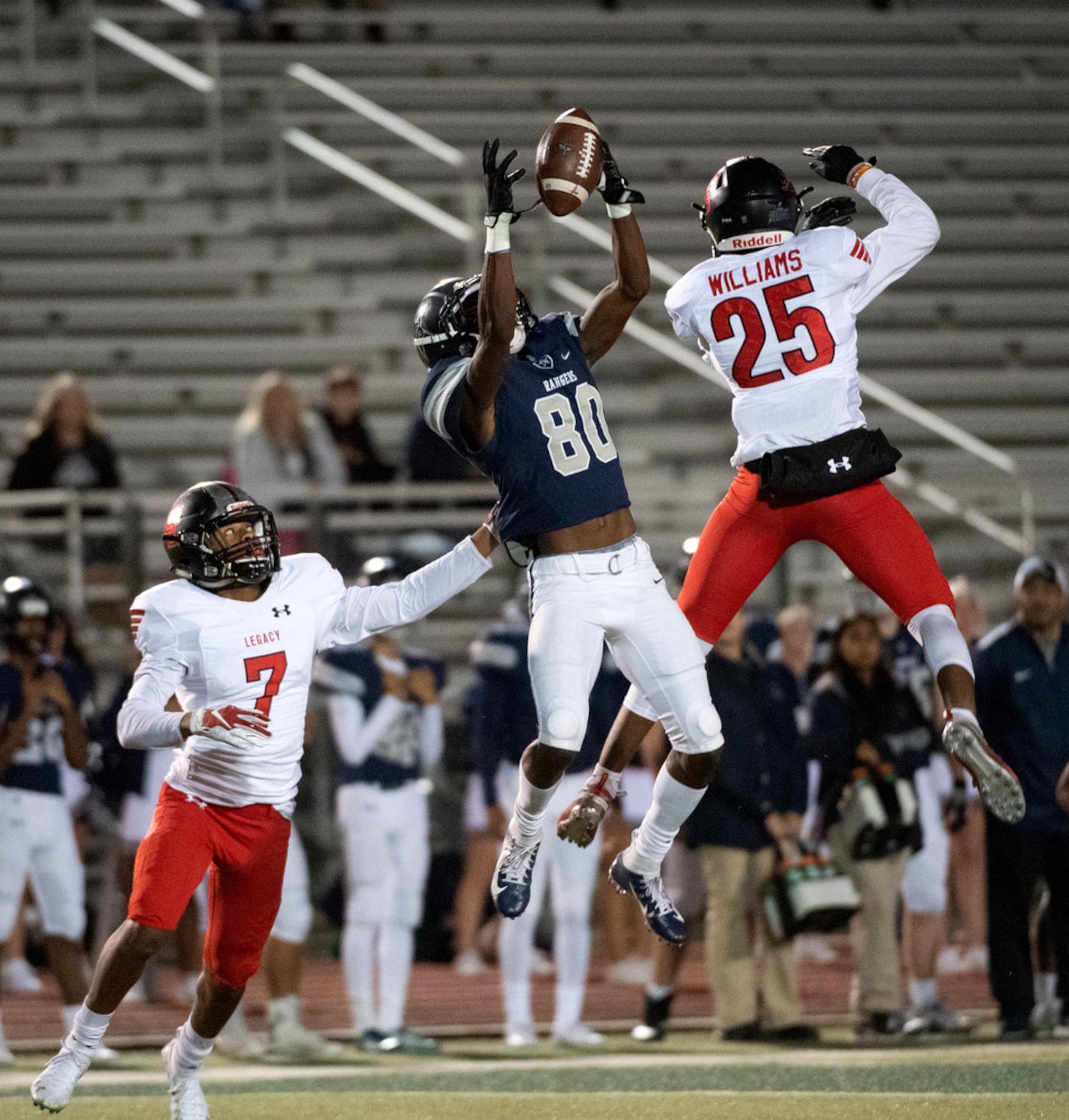 Frisco Lone Star senior wide receiver Ife Opere (80) hauls in a third down catch over...