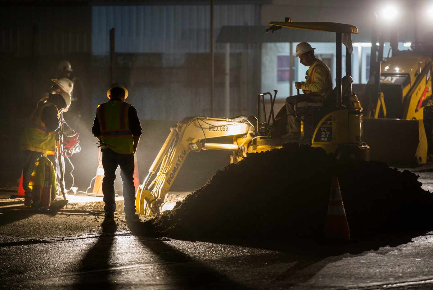 Crews work on gas lines after a fire station was evacuated because of a gas leak on Tuesday...