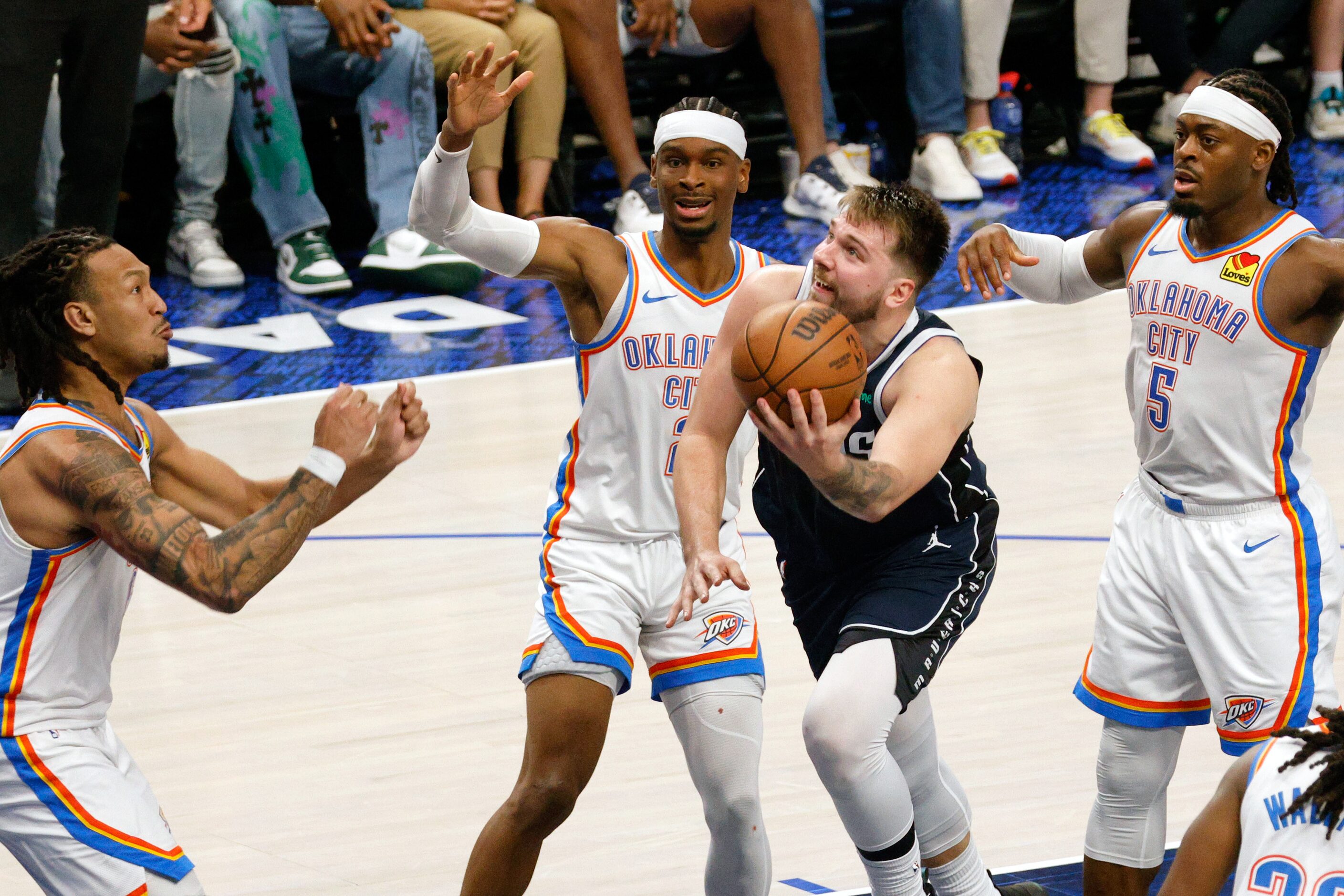 Dallas Mavericks guard Luka Doncic (77) goes to shoot the ball as Oklahoma City Thunder...