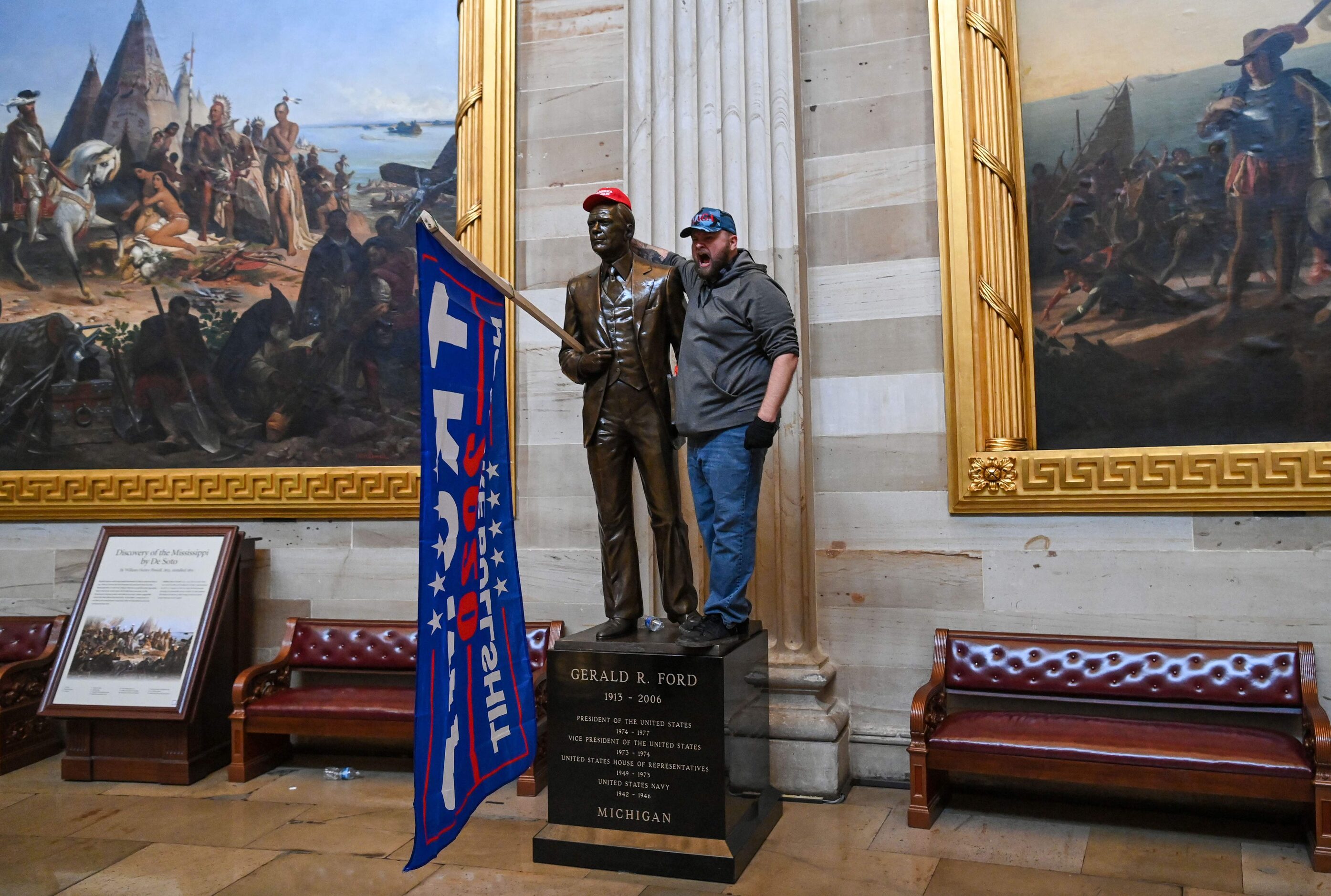 Supporters of US President Donald Trump enter the US Capitol's Rotunda on January 6, 2021,...