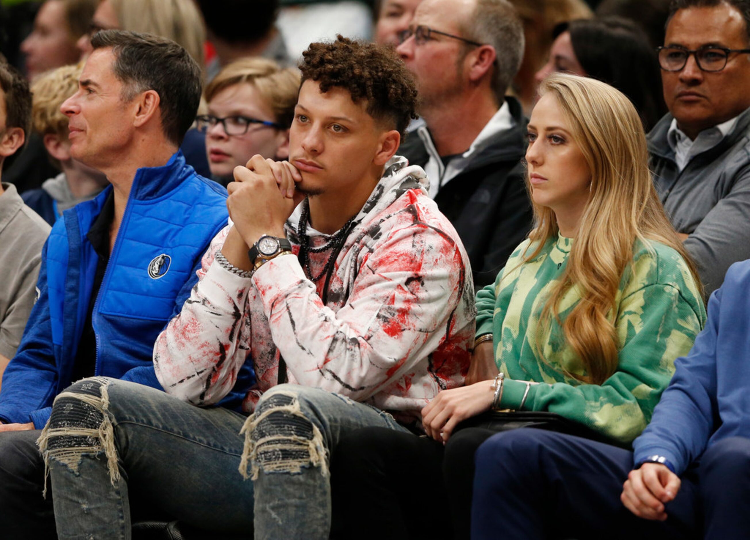 Kansas City Chiefs quarterback Patrick Mahomes sits court side during the first quarter of...